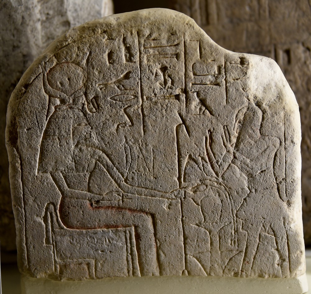 Stela_showing__Isis_the_Great_Goddess__sitting_and_holding_a_was-sceptre._A_man,_the_head_of_necropolis_workers,_adores_her._From_Egypt,_Middle_Kingdom._The_Petrie_Museum_of_Egyptian_Archaeology,_London.jpg