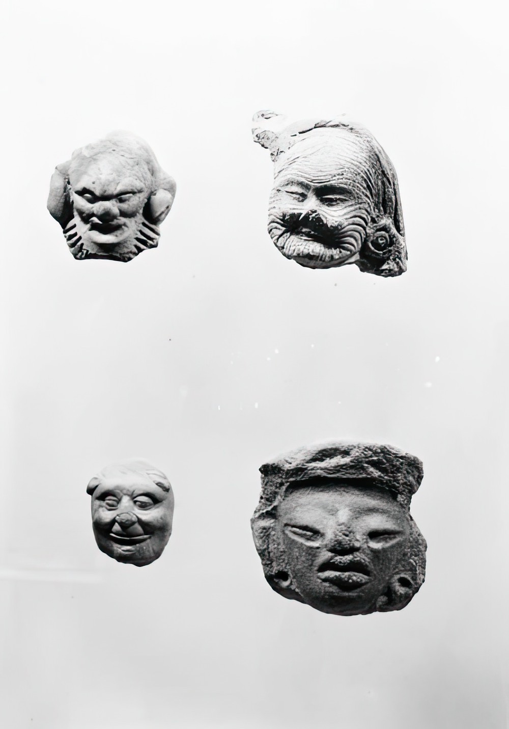 four-carved-figurine-fragments_64ac1842-80b0-4d77-8732-5ac83b6ee2e3.jpg