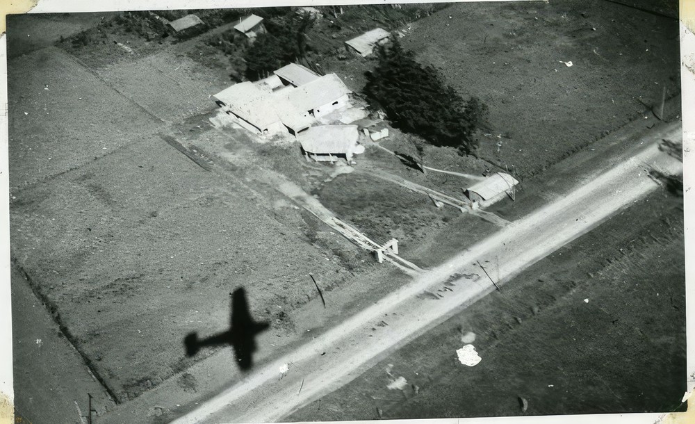 scan-of-photograph-from-judge-burt-cosgrove-photo-album-shadow-of-our-plane-in-copan_0b17f495-5c5a-4886-b918-d7c82a4da492.jpg